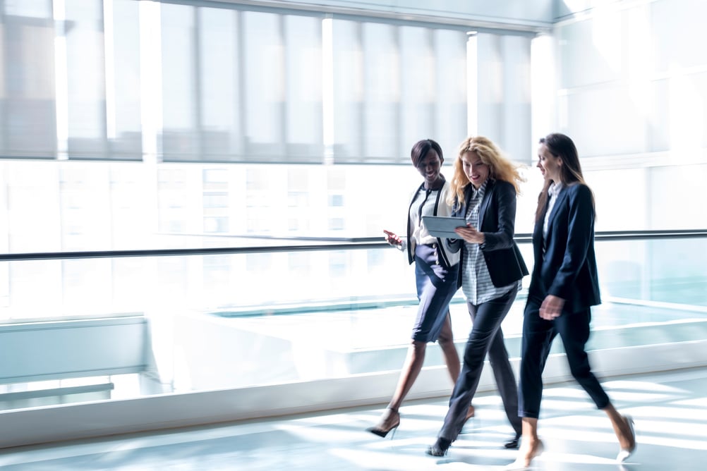 Business women walking in a hall